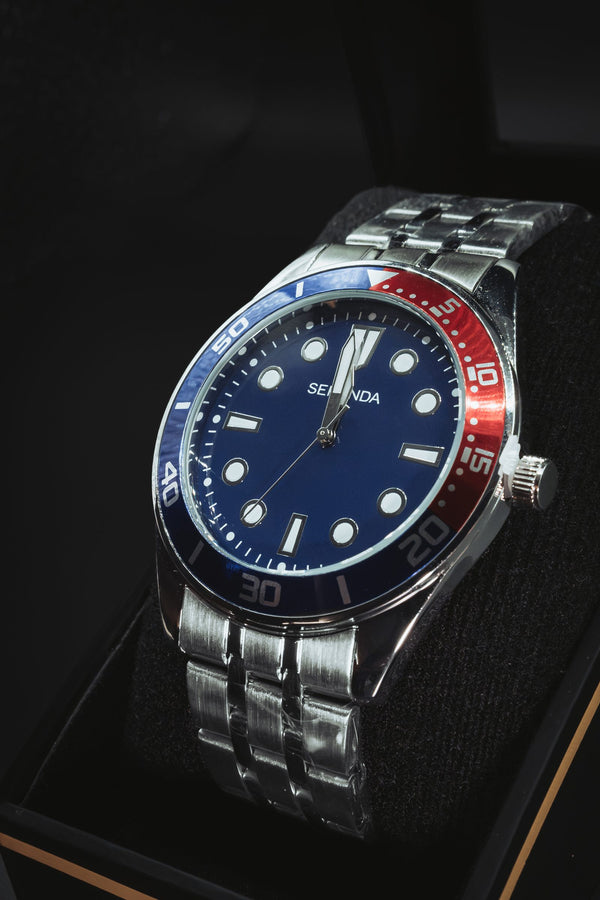 Sekonda dive-style watch with a navy dial and red and blue bezel