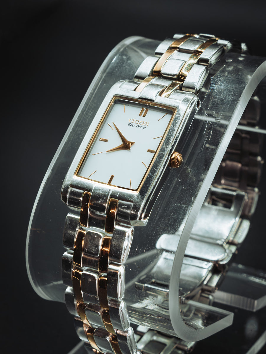 Citizen Eco-Drive rectangular watch with a white dial on a two-tone bracelet