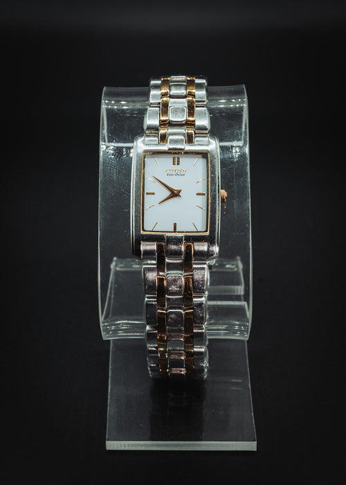 Citizen Eco-Drive rectangular on a clear display stand