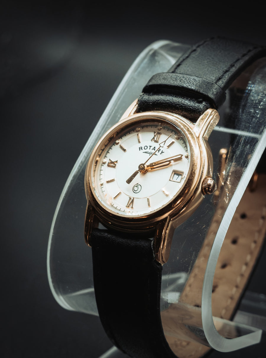 Gold-tone Rotary with a silver dial on black leather