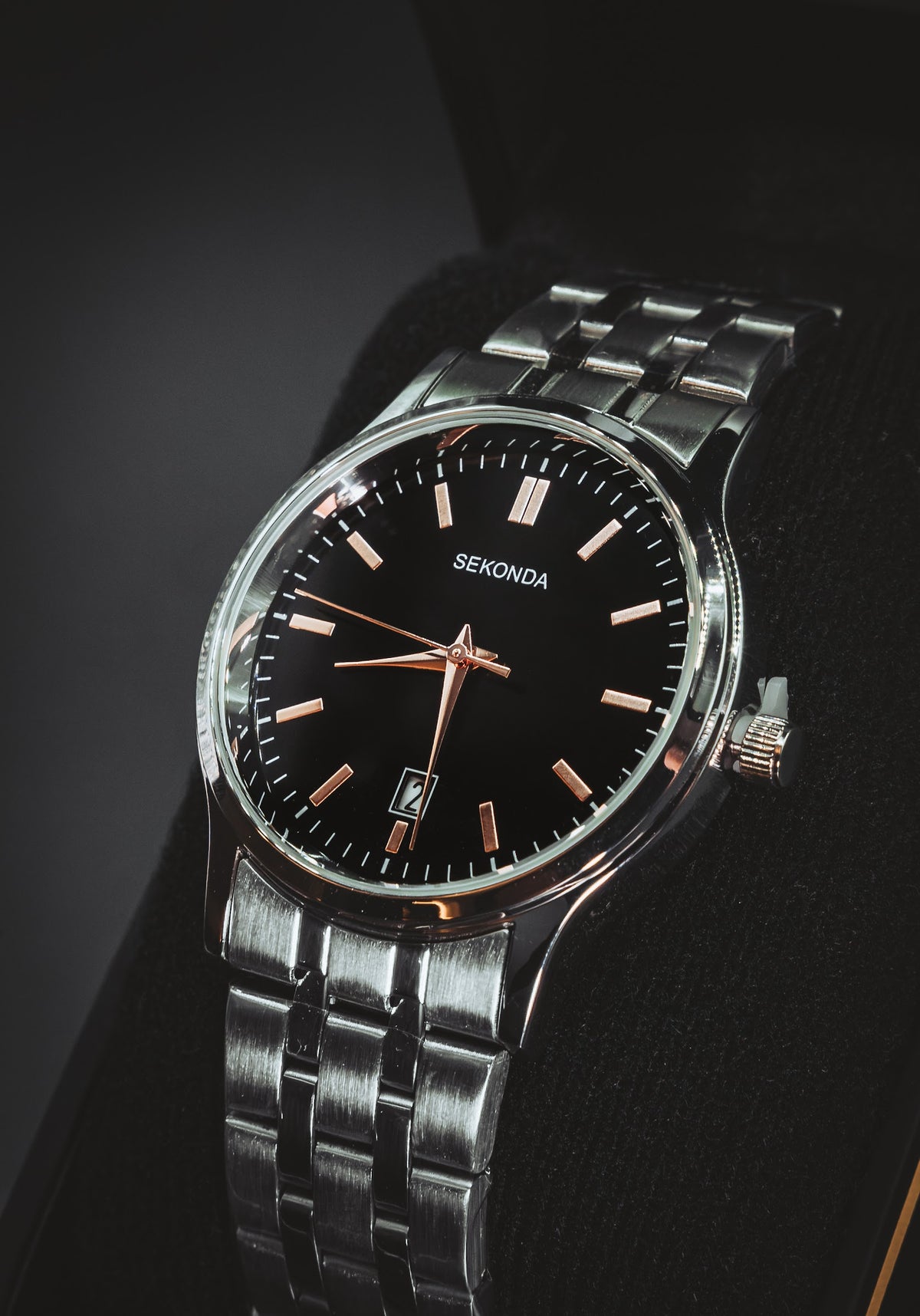 Sekonda with a black dial and rose-gold-tone markers on a steel bracelet