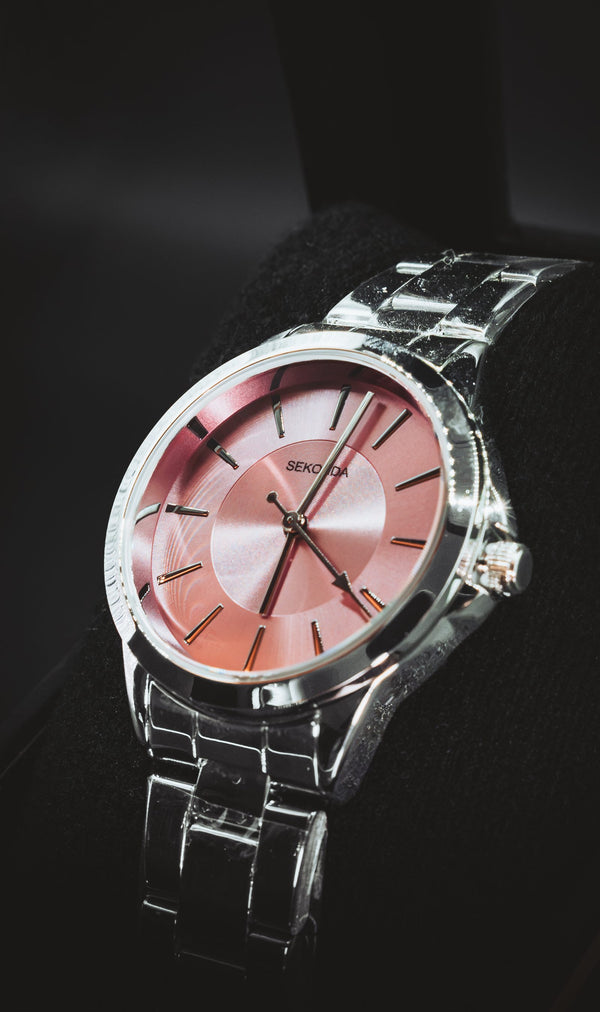 Sekonda with a pink sunburst dial on a steel bracelet